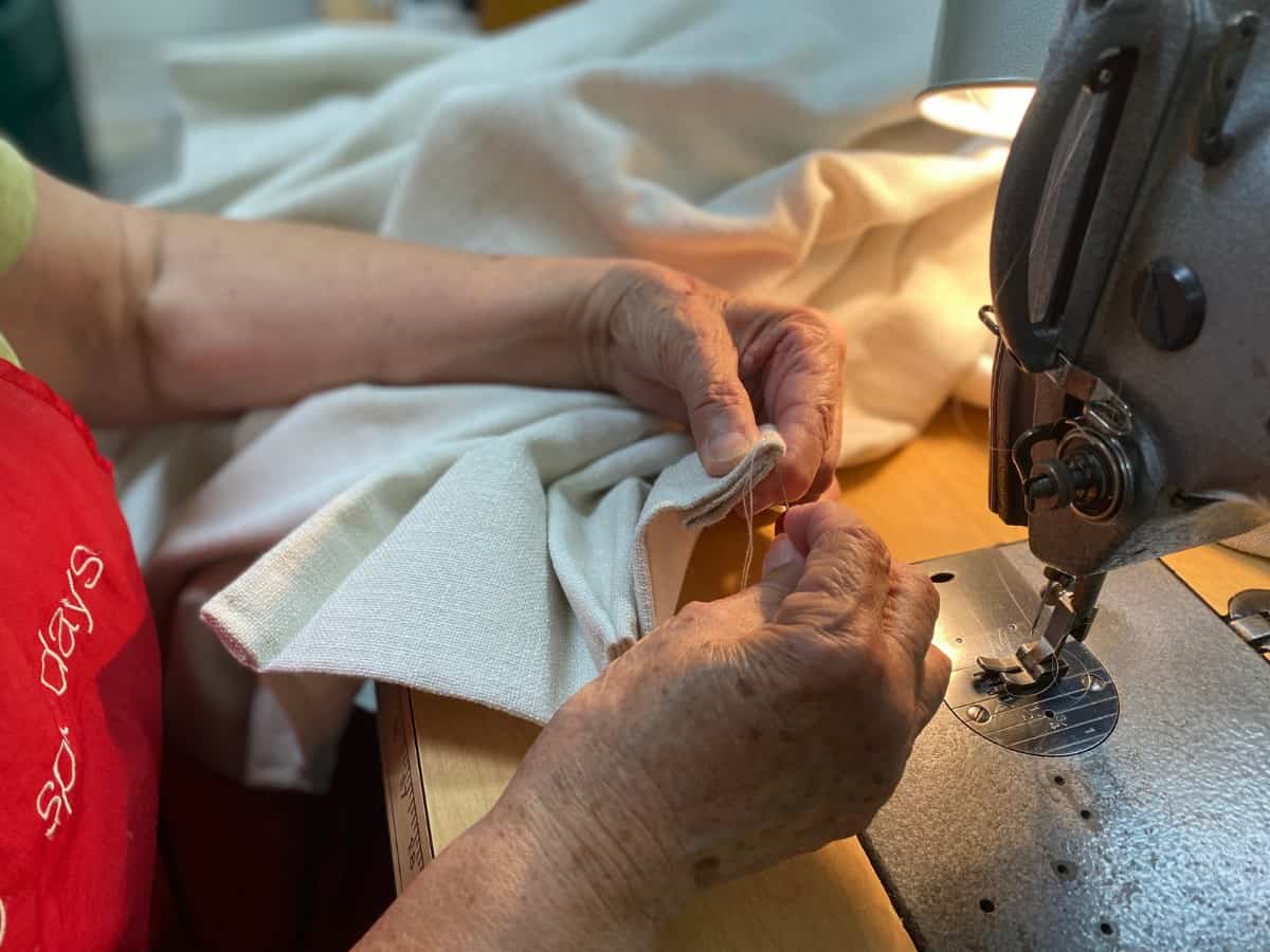 Hand sewing of drapery hems