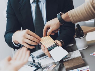 close-up-manager-is-showing-color-swatches-couple-clients_99043-798